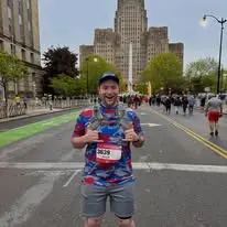 Joseph smiling during a downtown road race